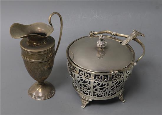 A George V pierced silver sugar basket and cover, Charles Boyton & Sons Ltd, Birmingham, 1926, a silver cream jug and silver spoon.